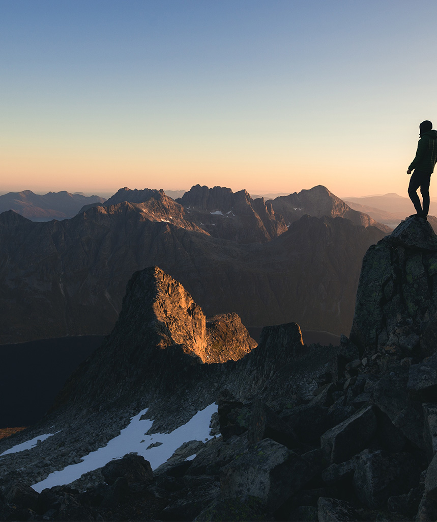 Man looking over mountain landscape